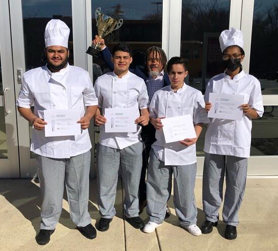 Students pose with their culinary awards